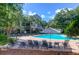 Enjoy this pristine pool with lounge chairs and beautiful landscaping at 300 Bucksley Ln # 104, Charleston, SC 29492