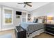 Bedroom with natural light, a mounted television, and elegant furnishings, with a modern ceiling fan at 3034 Bell Cv Aly, Johns Island, SC 29455