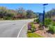 Welcome to the community, marked by a sign with beautiful flowers and lush greenery at 3034 Bell Cv Aly, Johns Island, SC 29455