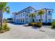 Elegant building exterior featuring palm trees, manicured landscaping, and a serene waterfront ambiance at 3034 Bell Cv Aly, Johns Island, SC 29455