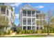 Three story home with screened in porches and lush landscaping at 3034 Bell Cv Aly, Johns Island, SC 29455