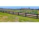 Well-maintained fenced pasture provides a secure and scenic area for livestock or recreation at 3034 Bell Cv Aly, Johns Island, SC 29455