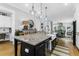 Spacious kitchen featuring a large island, farmhouse sink, and pendant lighting at 3034 Bell Cv Aly, Johns Island, SC 29455