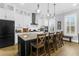 Stylish kitchen boasting stainless steel appliances and a large island with barstool seating at 3034 Bell Cv Aly, Johns Island, SC 29455