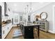 Charming kitchen with a large island, sleek countertops, and modern pendant lights at 3034 Bell Cv Aly, Johns Island, SC 29455