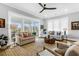 Inviting living room with large windows and comfortable seating at 3034 Bell Cv Aly, Johns Island, SC 29455