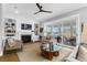 Inviting living room with fireplace, built-in shelves, and sliding glass doors to screened porch at 3034 Bell Cv Aly, Johns Island, SC 29455
