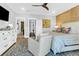 Spacious main bedroom with en suite bathroom, ceiling fan, seating area, and bright décor at 3034 Bell Cv Aly, Johns Island, SC 29455