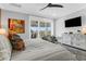 View of bright main bedroom with balcony access, television, and a light gray color scheme at 3034 Bell Cv Aly, Johns Island, SC 29455