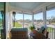 Relaxing screened porch with comfortable seating and beautiful views of the surrounding neighborhood at 3034 Bell Cv Aly, Johns Island, SC 29455