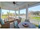 Comfortable screened porch with ample seating and views of the neighborhood at 3034 Bell Cv Aly, Johns Island, SC 29455