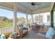 Relaxing screened porch with ample seating and views of the community at 3034 Bell Cv Aly, Johns Island, SC 29455