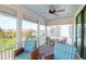 Inviting screened porch with comfortable seating and serene community views at 3034 Bell Cv Aly, Johns Island, SC 29455