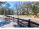 Wander along the community's beautiful walking path, framed by mature trees and a charming fence at 3034 Bell Cv Aly, Johns Island, SC 29455