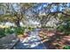 Scenic walking path with park benches shaded by mature trees in a tranquil setting at 3034 Bell Cv Aly, Johns Island, SC 29455