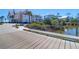 Scenic walkway of a waterfront community, with beautiful houses, lush foliage, and a calming water view at 3034 Bell Cv Aly, Johns Island, SC 29455