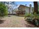Spacious backyard includes a patio, deck, fire pit, and lush landscaping, perfect for outdoor living at 309 Edinburgh St, Summerville, SC 29483