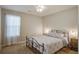 Cozy bedroom featuring soft carpet, a metal bed frame, and plenty of natural light at 309 Edinburgh St, Summerville, SC 29483