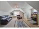 Comfortable bonus room offers plush seating, a TV, and cozy carpet at 309 Edinburgh St, Summerville, SC 29483