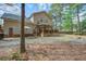 Two-story home with backyard deck, patio and fire pit, ideal for outdoor entertaining at 309 Edinburgh St, Summerville, SC 29483