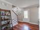 Bright entryway with hardwood floors, stairs, and a decorative glass front door at 309 Edinburgh St, Summerville, SC 29483