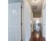 Hallway with hardwood flooring and neutral walls, connecting to other areas of the home at 309 Edinburgh St, Summerville, SC 29483