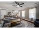 Cozy living area with hardwood floors, neutral walls, ceiling fan and lots of natural light at 309 Edinburgh St, Summerville, SC 29483