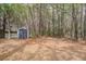 A storage shed in the backyard provides ample space for gardening tools and outdoor equipment at 309 Edinburgh St, Summerville, SC 29483