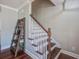 Bright staircase featuring hardwood floors and decorative shelf for an eye-catching design at 309 Edinburgh St, Summerville, SC 29483