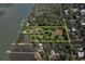 Aerial view of large parcel outlining property lines and showcasing the water access, mature trees, and structures at 410 E Indian Ave, Folly Beach, SC 29439