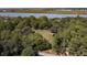 Expansive wooded lot with a storage shed and marsh views at 410 E Indian Ave, Folly Beach, SC 29439