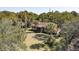 Charming single story home with mature trees and a screened in porch at 410 E Indian Ave, Folly Beach, SC 29439