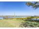 Beautiful waterfront property with a private dock, lush greenery, and stunning views of the water at 410 E Indian Ave, Folly Beach, SC 29439