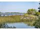 Marshy waterfront with beautiful water views and a worn boardwalk leading to a scenic overlook at 410 E Indian Ave, Folly Beach, SC 29439