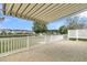 Back patio overlooking a scenic pond with a fountain and retractable awning at 418 Eastern Isle Ave, Summerville, SC 29486