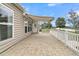 Back patio overlooking a scenic pond with a fountain, featuring a retractable awning at 418 Eastern Isle Ave, Summerville, SC 29486