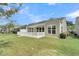 Backyard featuring a patio, a well-maintained lawn, and a pond view at 418 Eastern Isle Ave, Summerville, SC 29486
