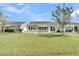 Backyard featuring a patio, a well-maintained lawn, and a pond view at 418 Eastern Isle Ave, Summerville, SC 29486