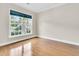 Sunlit bedroom with gleaming hardwood floors and a large window at 418 Eastern Isle Ave, Summerville, SC 29486