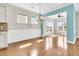 Inviting dining area with ample natural light, chandelier, and stylish wainscoting at 418 Eastern Isle Ave, Summerville, SC 29486