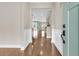 Warm and welcoming foyer with gleaming hardwood floors and a view of the open-concept living space at 418 Eastern Isle Ave, Summerville, SC 29486