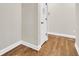 Hallway with hardwood floors, white trim, and neutral walls at 418 Eastern Isle Ave, Summerville, SC 29486