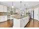 Spacious kitchen with a granite island, stainless steel appliances, and stylish pendant lighting at 418 Eastern Isle Ave, Summerville, SC 29486