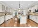 Bright kitchen featuring a large island, stainless steel appliances, and beautiful hardwood floors at 418 Eastern Isle Ave, Summerville, SC 29486