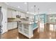Modern kitchen with stainless steel appliances, granite countertops, and a large center island with bar seating at 418 Eastern Isle Ave, Summerville, SC 29486