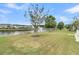 Relaxing pond scenery featuring a water fountain and manicured green lawn at 418 Eastern Isle Ave, Summerville, SC 29486