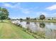 Picturesque view of the pond with fountain feature and beautifully landscaped shoreline at 418 Eastern Isle Ave, Summerville, SC 29486