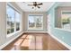 Cozy sun room with multiple windows offering scenic backyard views and abundant natural light at 418 Eastern Isle Ave, Summerville, SC 29486