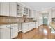 Charming wet bar with white cabinets, granite countertops, a diamond backsplash, and a wine rack at 418 Eastern Isle Ave, Summerville, SC 29486