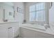 Bathroom with soaking tub, white vanity and neutral paint at 4218 Club Course Dr, North Charleston, SC 29420